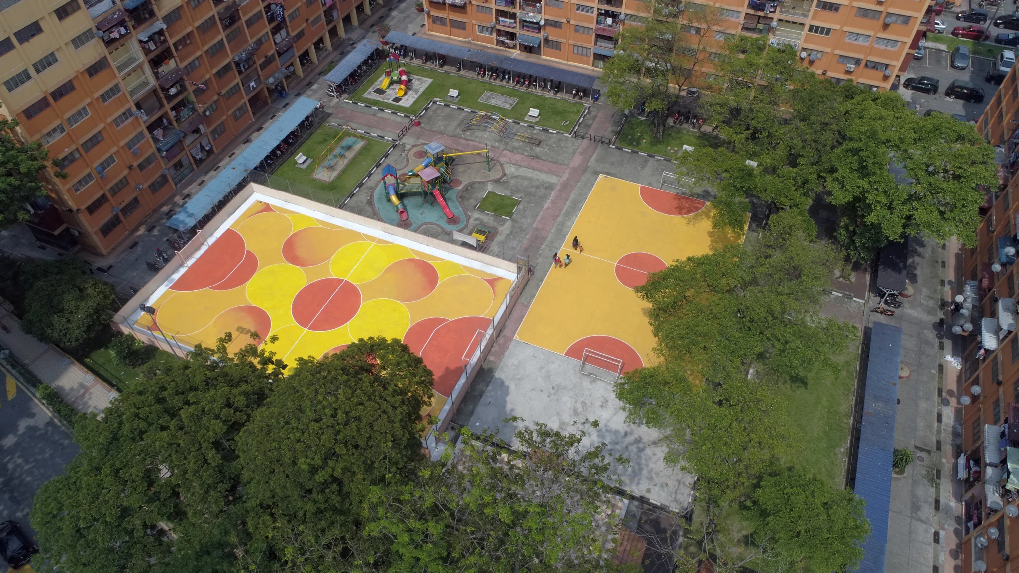 Colourful community sports courts seen from above